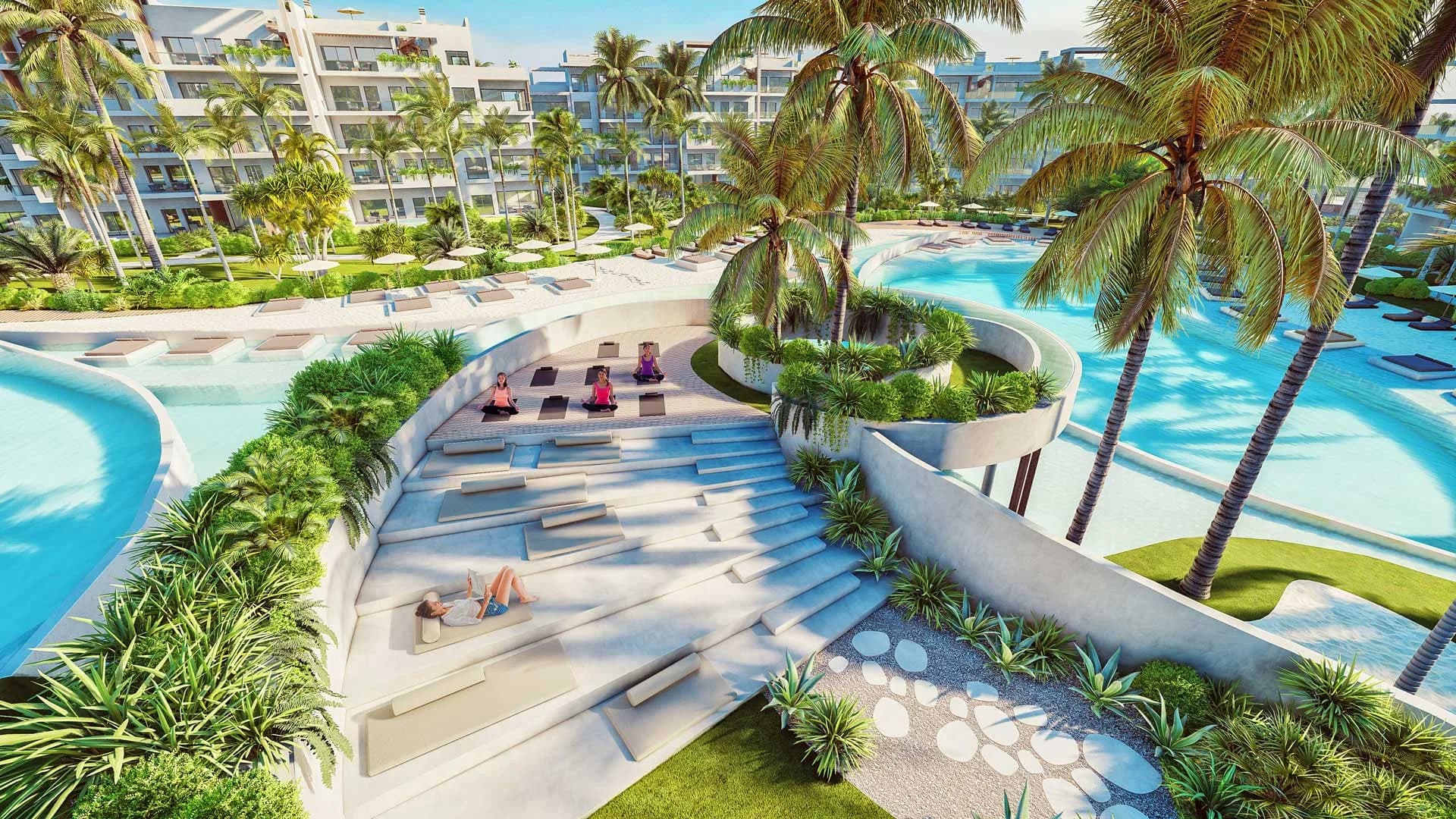 Planted terraces of the Cenote building with a yoga area beside the pools