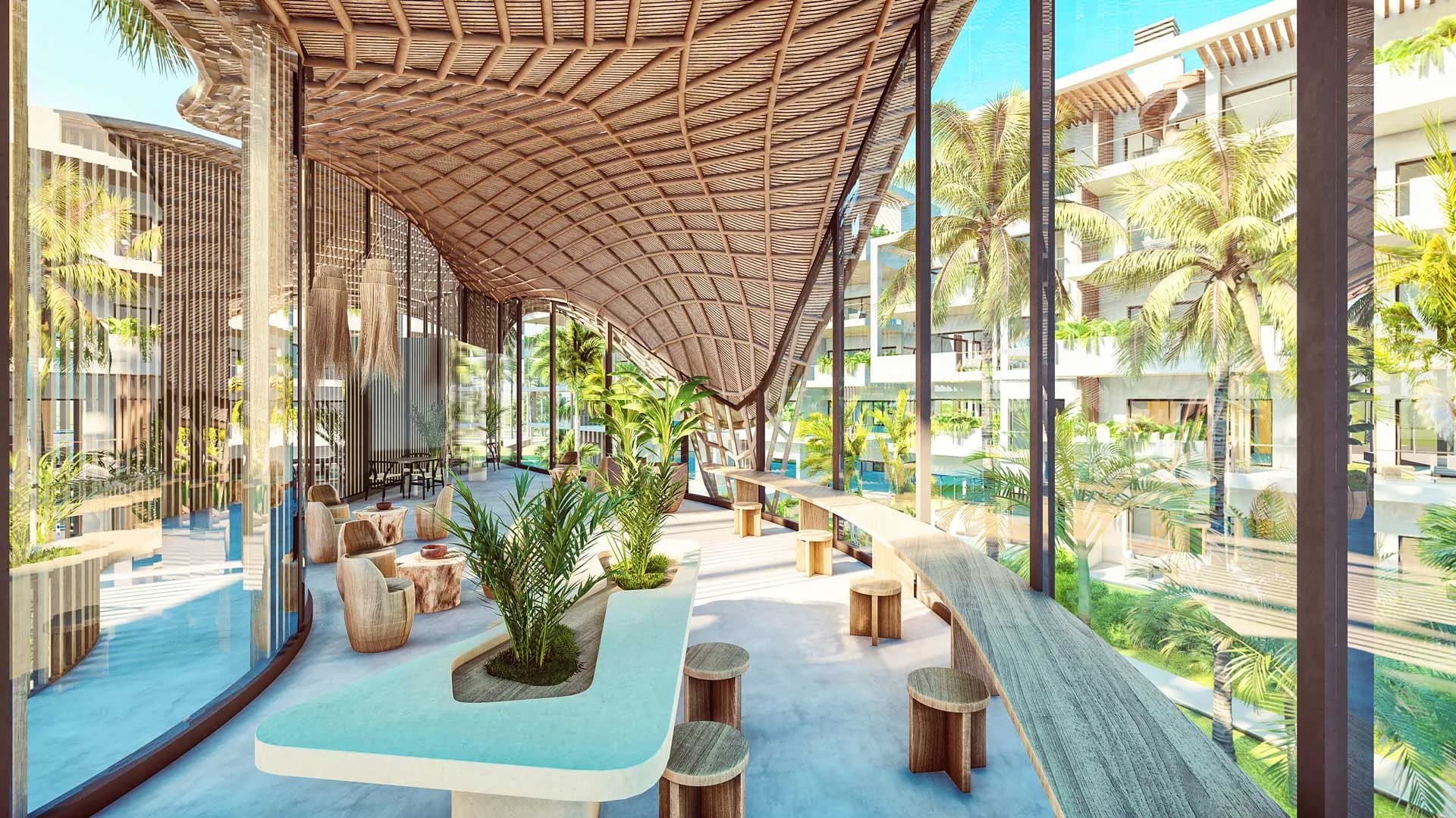 Coworking area with timber tables and views over the gardens