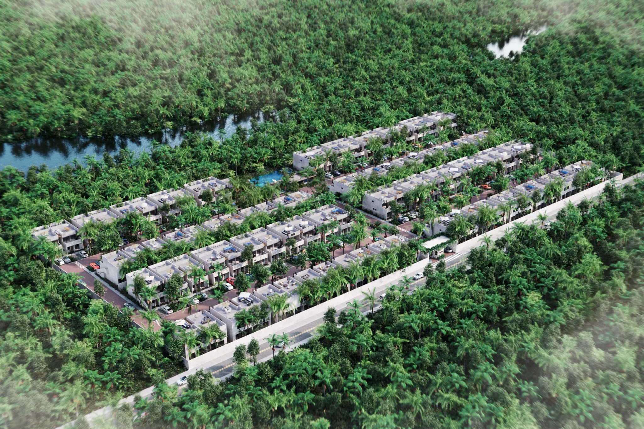 Aerial view of Kaoni: rows of homes surrounded by tropical forest, with a waterway behind