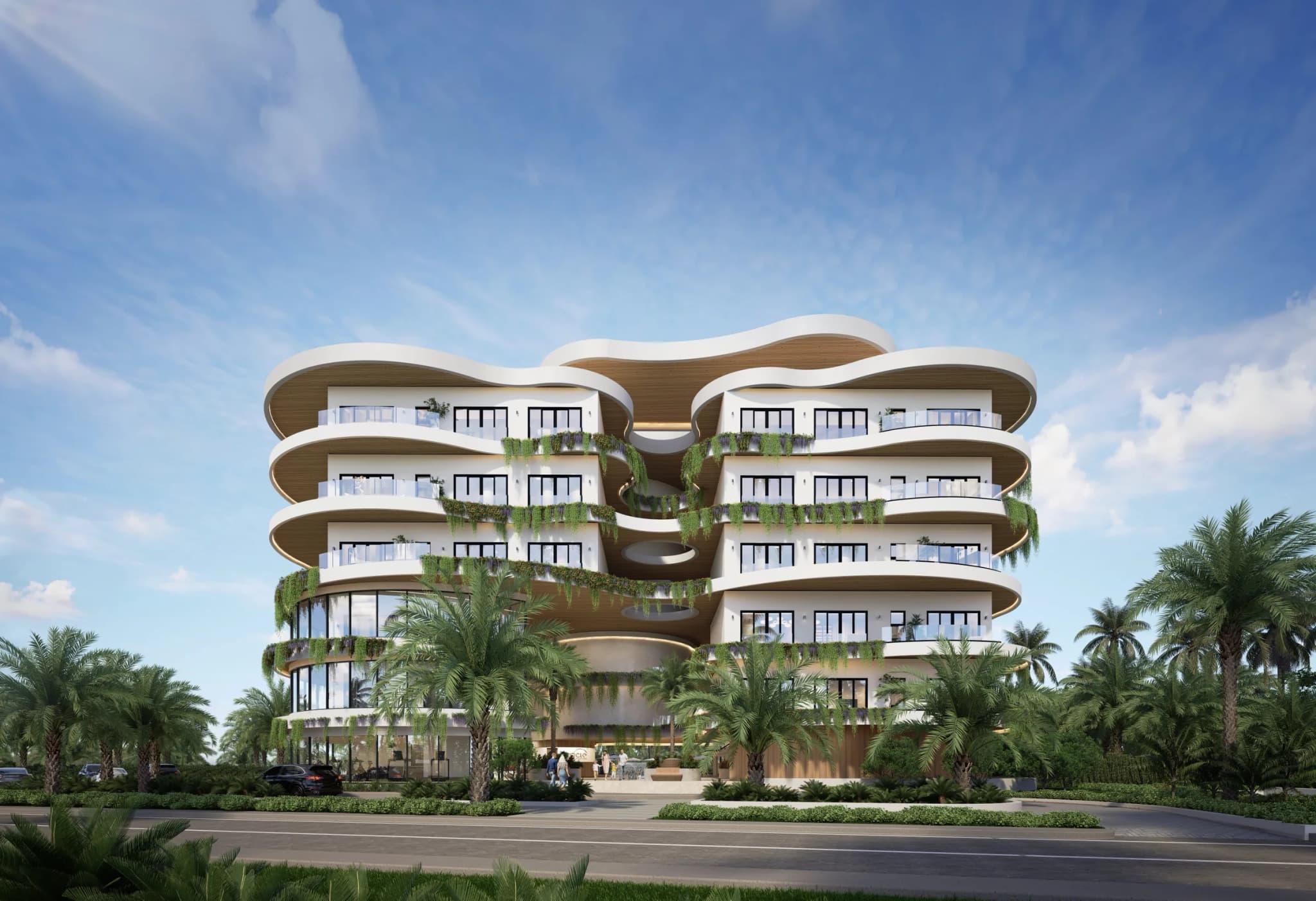 Fachada de Circle Residences, con balcones curvos en cada planta y palmeras en el acceso