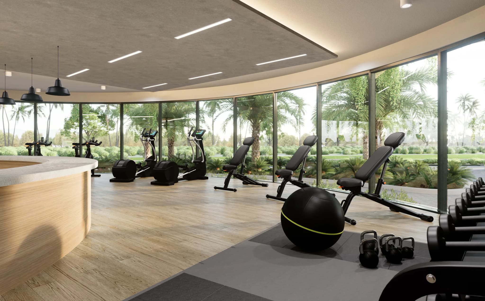 Gimnasio con ventanales curvos hacia el jardín
