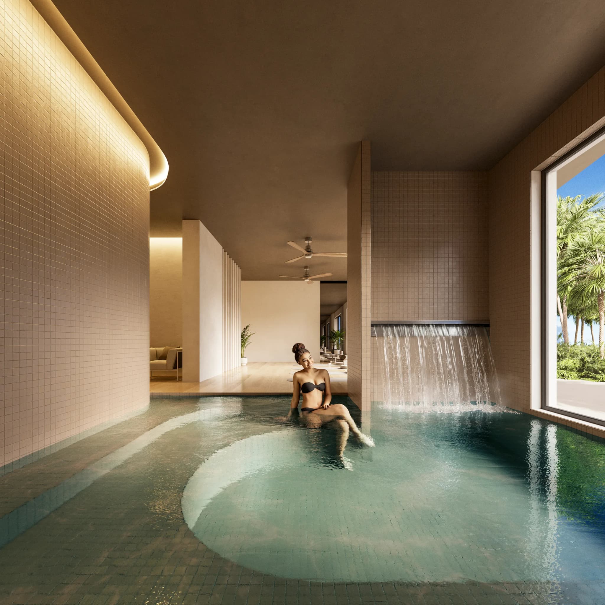 Piscina interior del spa con cascada