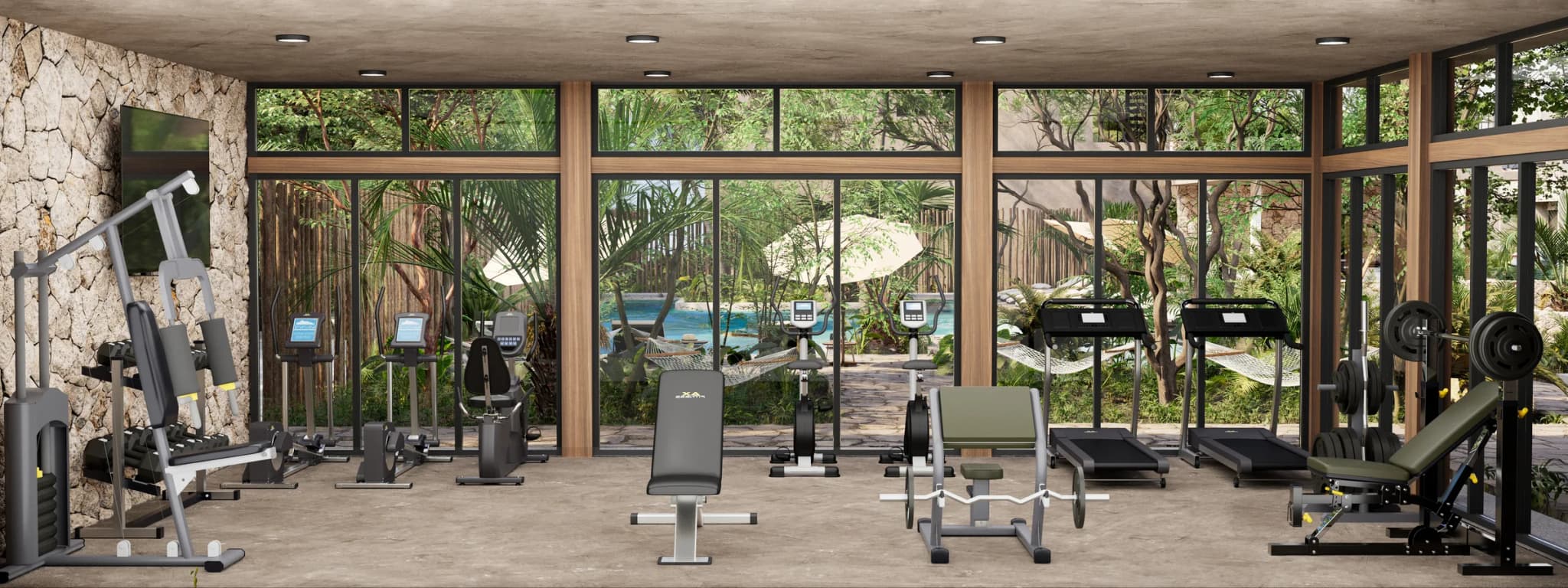 Glass-walled gym with cardio machines and weights, looking out to the gardens