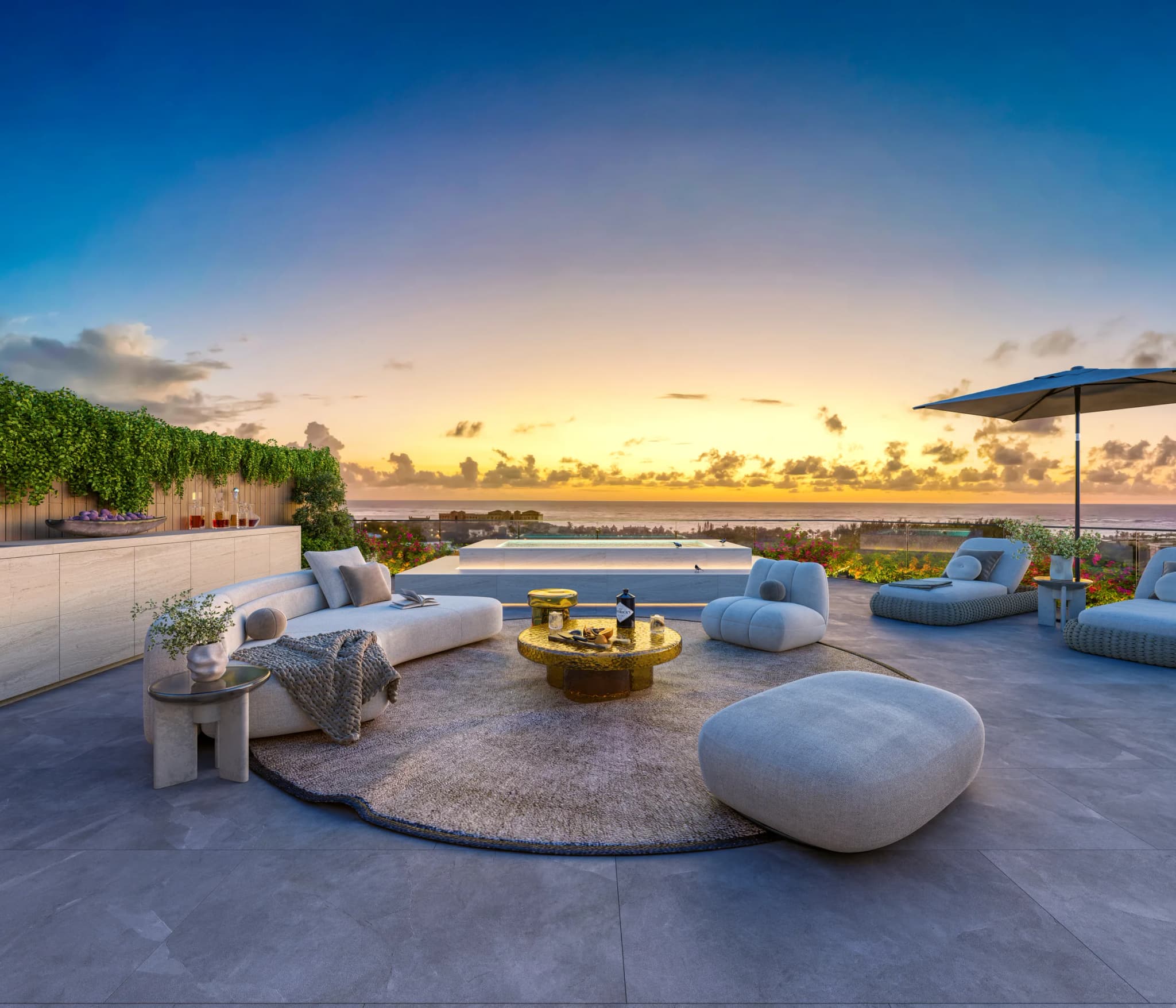 Terraza de un penthouse con plunge pool y vista al mar al amanecer
