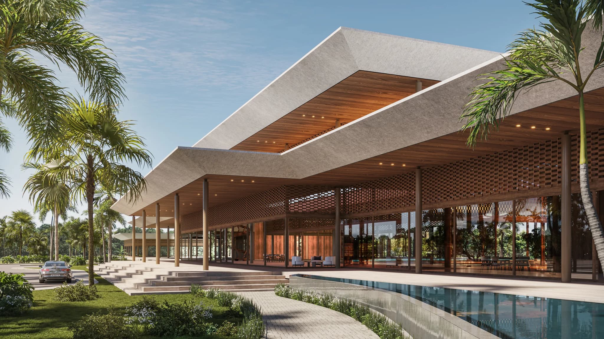 The La Reserva clubhouse, in the community where Kaoni sits: a broad-roofed building beside a pool
